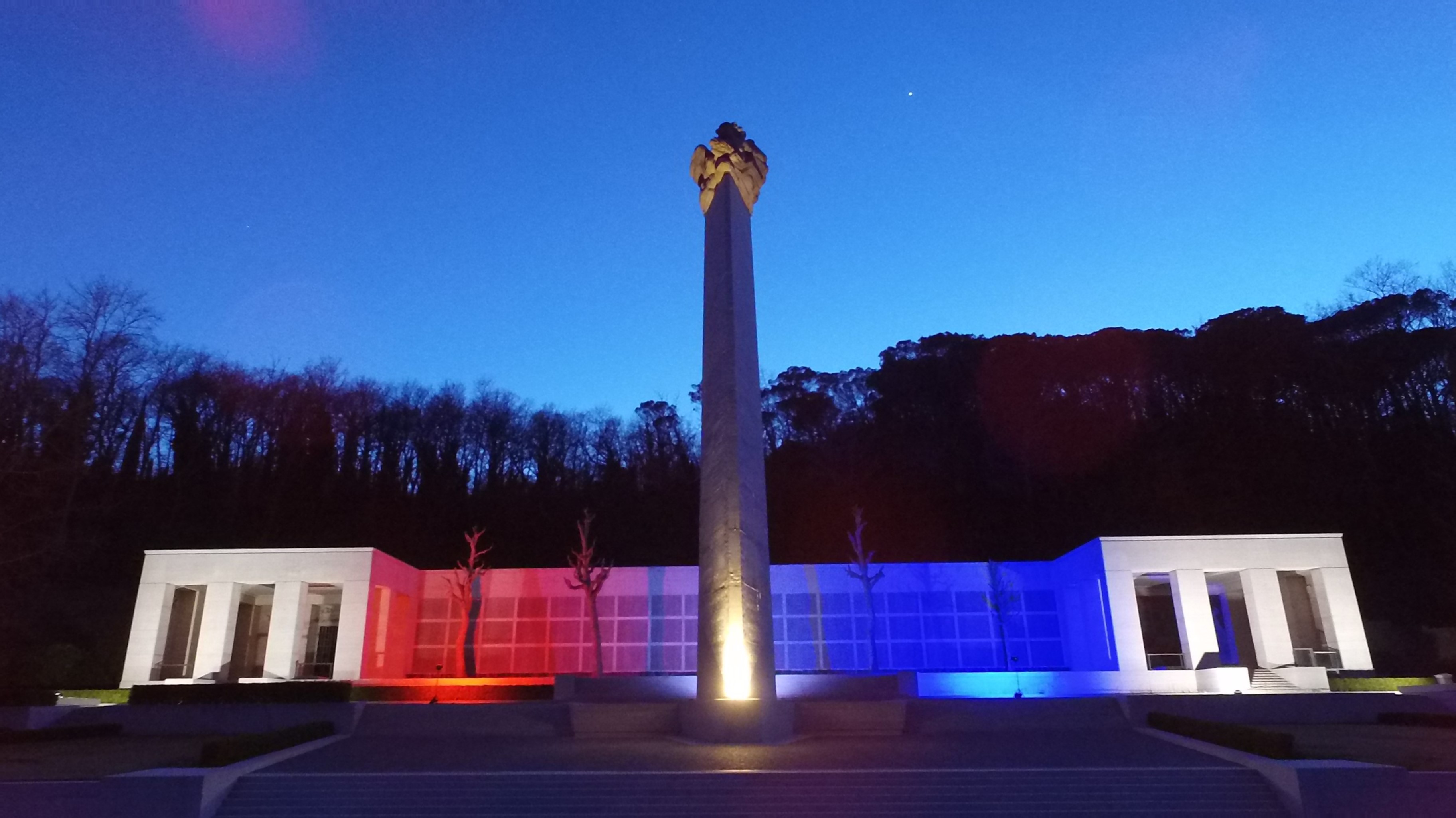 Florence American Cemetery is illuminated with American colors