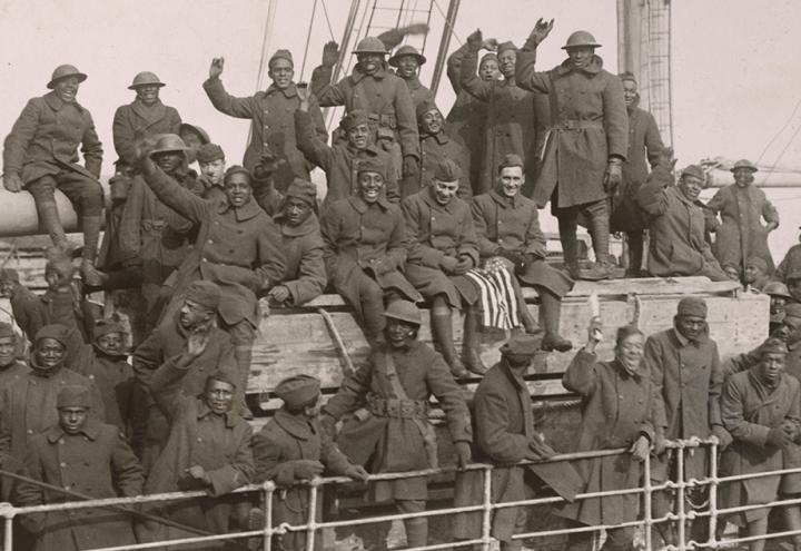 Members of the 369th Harlem Hellfighters infantry division return home to New York from France in February of 1919. Photo via National Archives, originally captured by Western Newspapers Union
