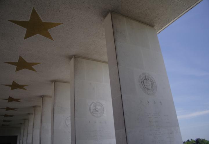 Columns and inlaid stars outside the memorial building at Henri-Chapelle American Cemetery.
