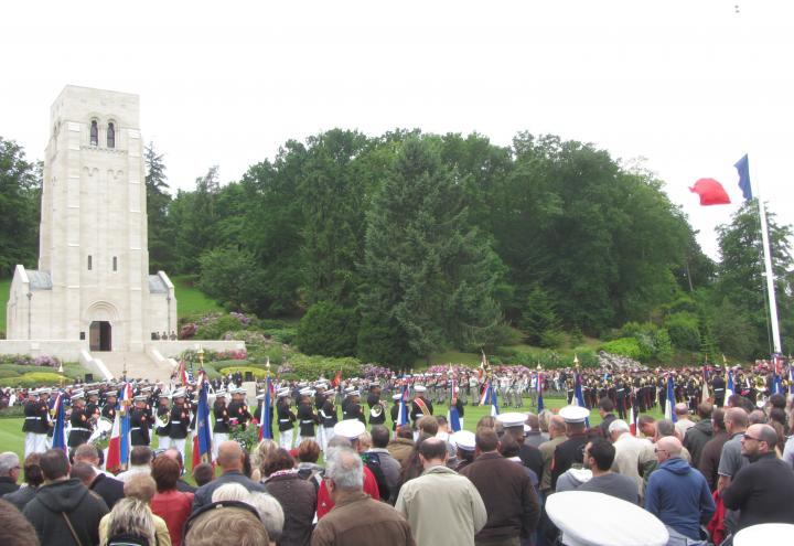 Thousands of people stand during the ceremony to get a glimpse of the event. 