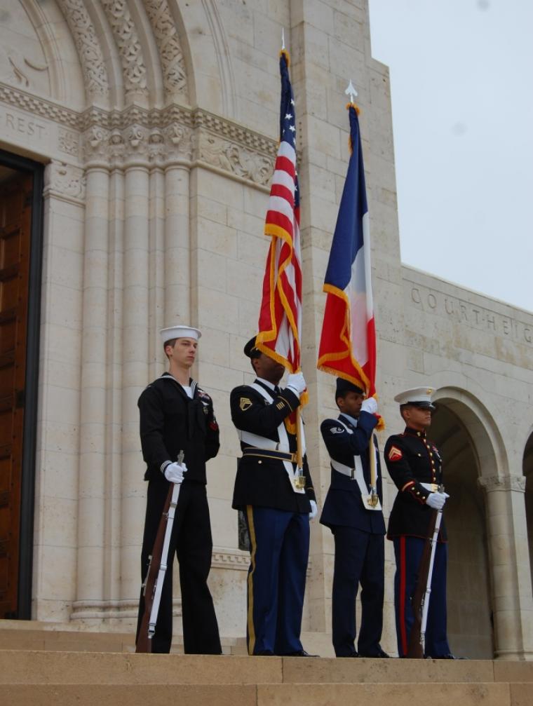 A U.S. Color Guard stands outside the chapel. 