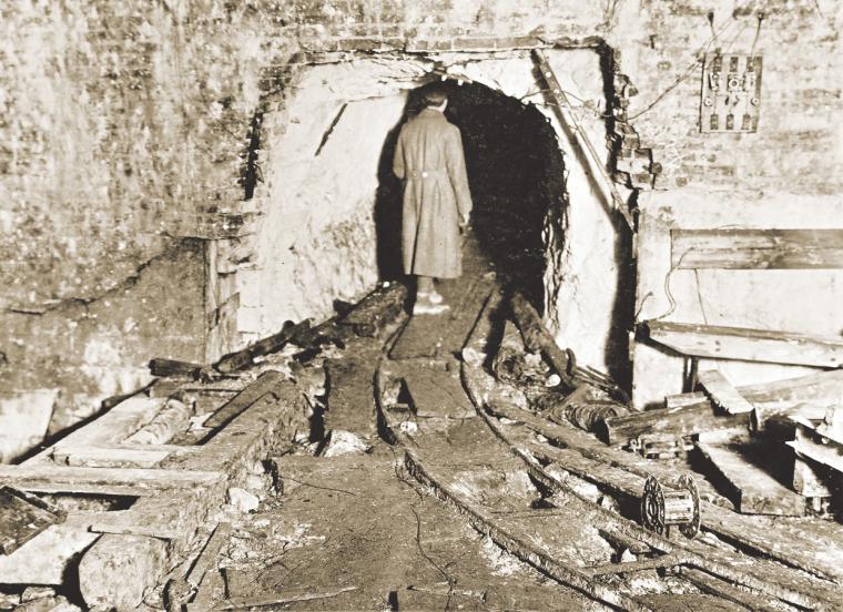 An American soldier explores one of the entrances Germans dug into the St. Quentin Canal tunnel.