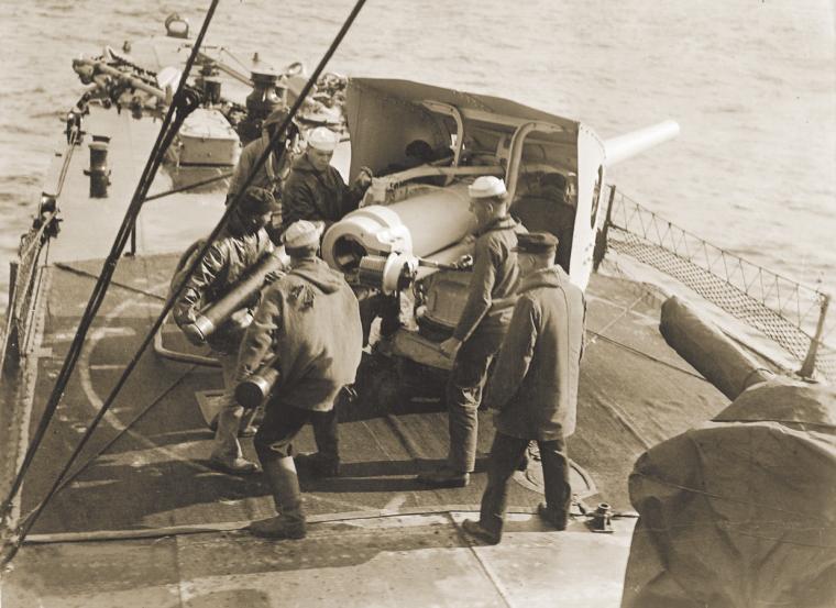 Gun crew practicing on a four-inch gun of the destroyer USS Little (DD-79).