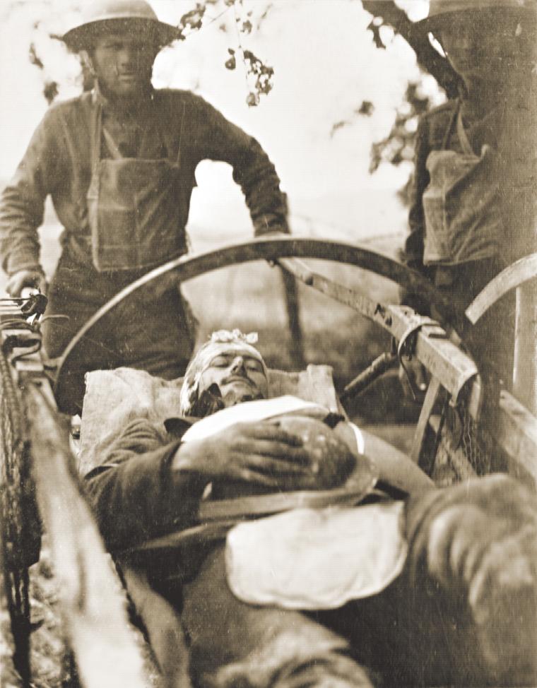 A wounded 1st Division soldier is evacuated for medical care during World War I.