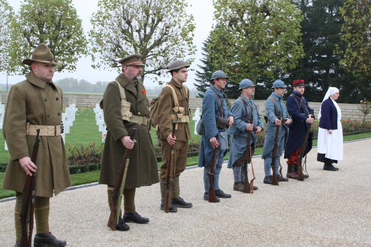 World War I re-enactors, dressed in period clothing, participate in the 2012 Veterans Day ceremony at Somme American Cemetery.