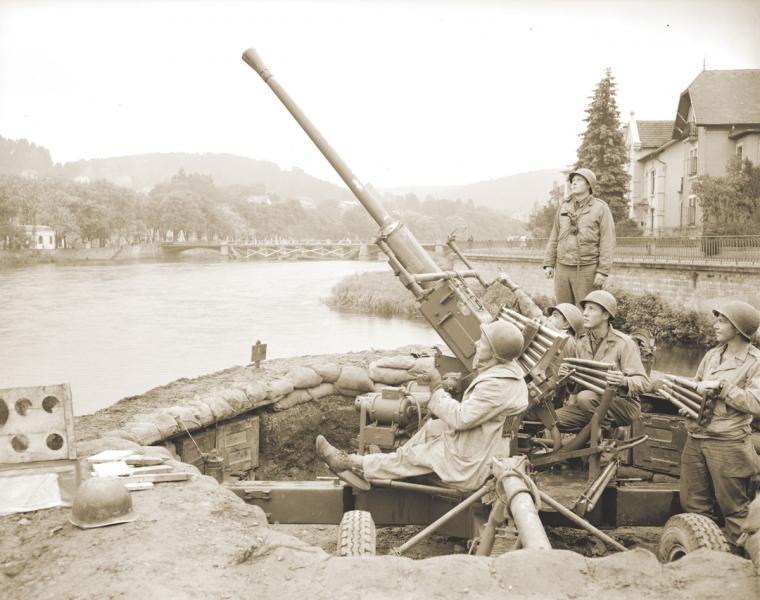 U.S. Army anti-aircraft gunners at the ready during World War II.