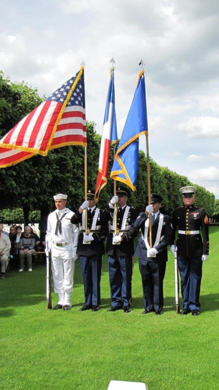 A U.S. Color Guard stands at attention. 