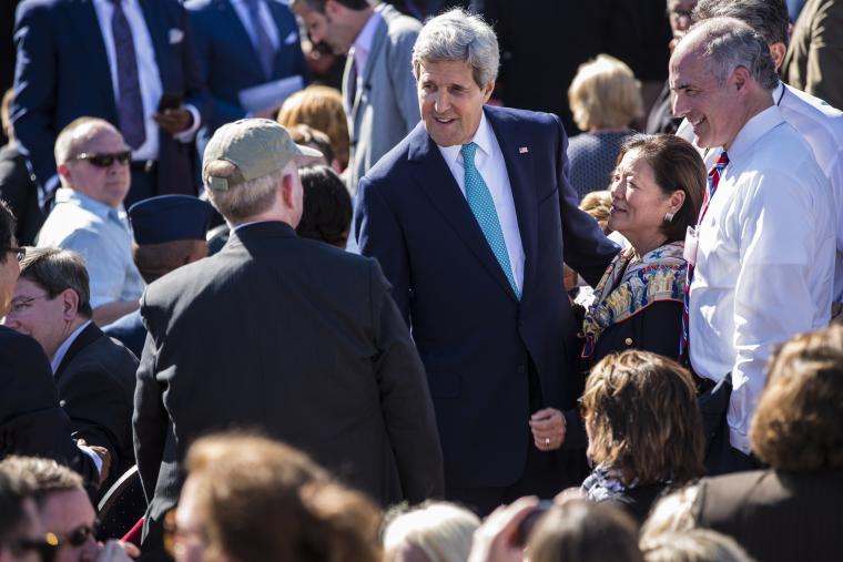 Secretary of State John Kerry greets guests. 