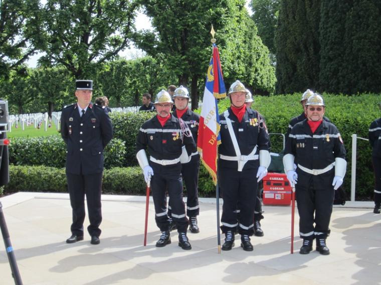 French firefighters stand at attention during the ceremony. 