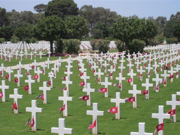 An American and Tunisian flag are in front of every marble headstone. 
