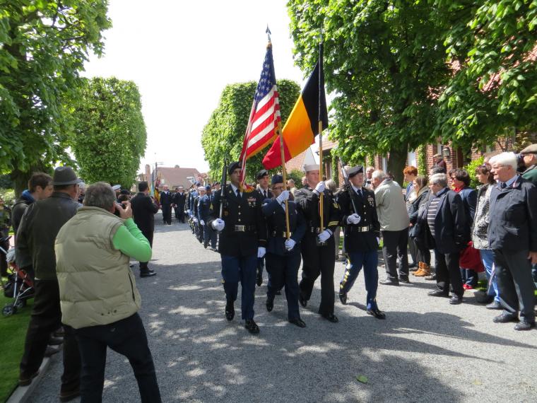 U.S. Color Guard marches into cemetery. 
