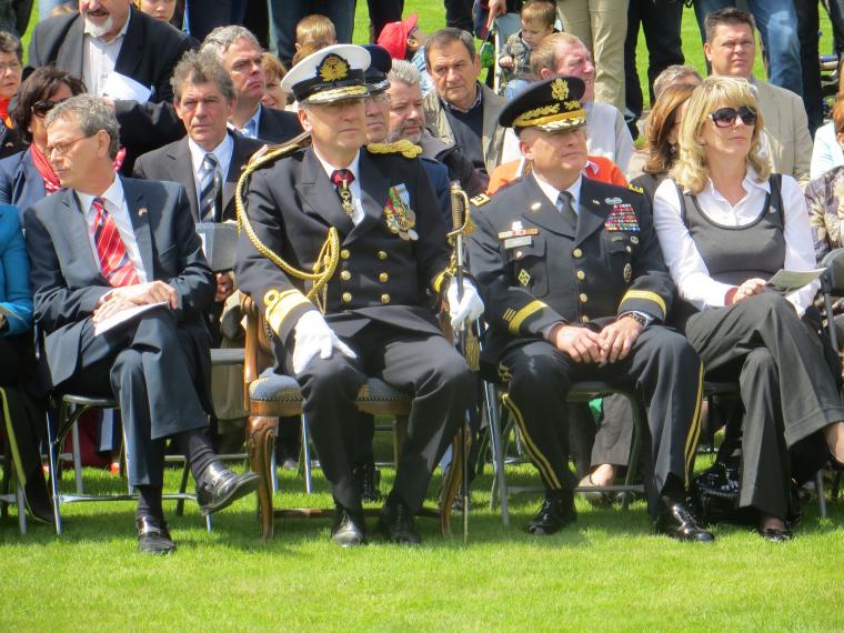 Military and government officials sit during Memorial Day ceremony. 