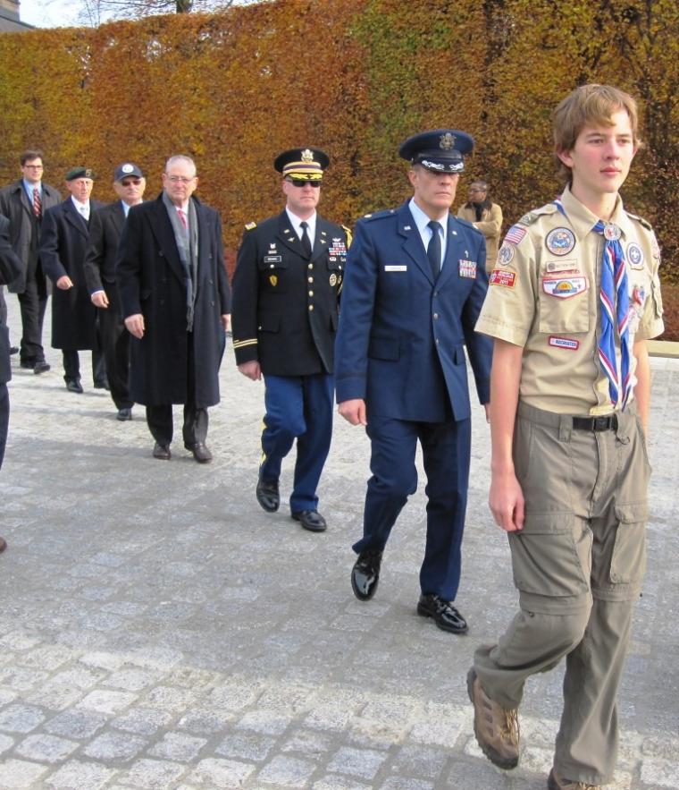 Participants form a straight line as they march in during the 2012 Veterans Day ceremony at Luxembourg American Cemetery.
