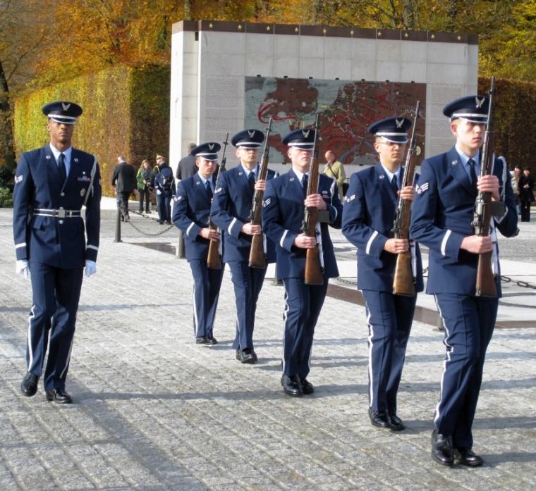 Five members of a firing detail stand in a straight line during the 2012 Veterans Day ceremony at Luxembourg American Cemetery. 