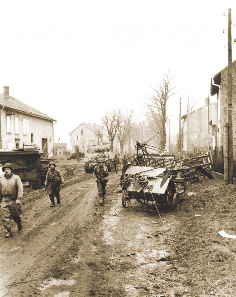 U.S. soldiers pursue German forces on the outskirts of Metz.