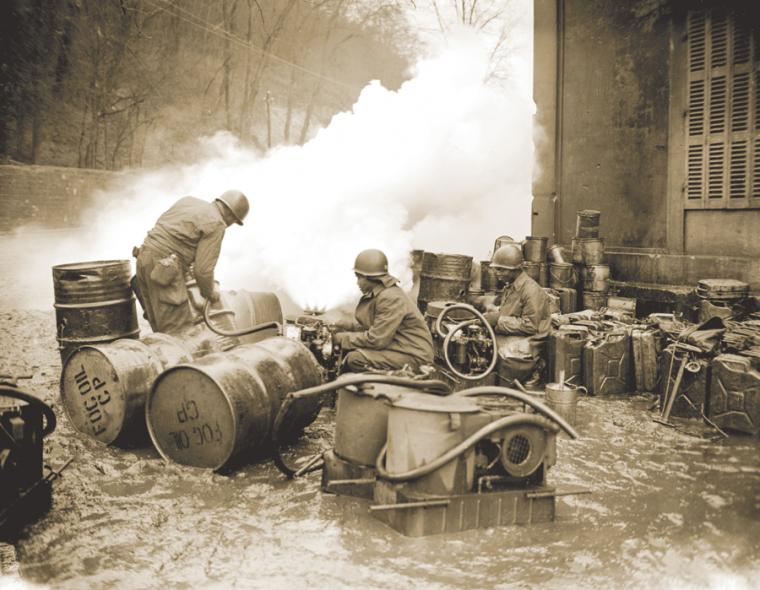 African-American soldiers lay a smoke screen to cover action over the Saar River.