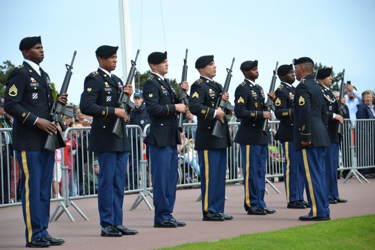 A firing detail participates in the 2012 Memorial Day ceremony at Normandy American Cemetery.