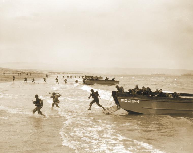 American soldiers plunge into the surf and wade to Utah Beach on June 6, 1944.