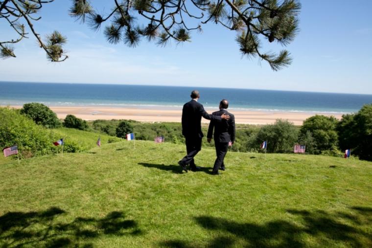 Presidents Obama and Hollande walk to the bluff overlooking Omaha Beach. 