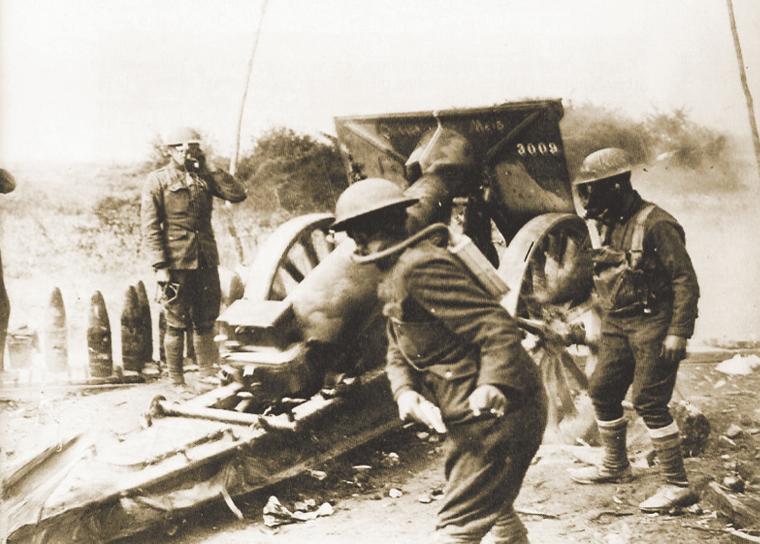 Soldiers prepare to fire a cannon in this historical image.
