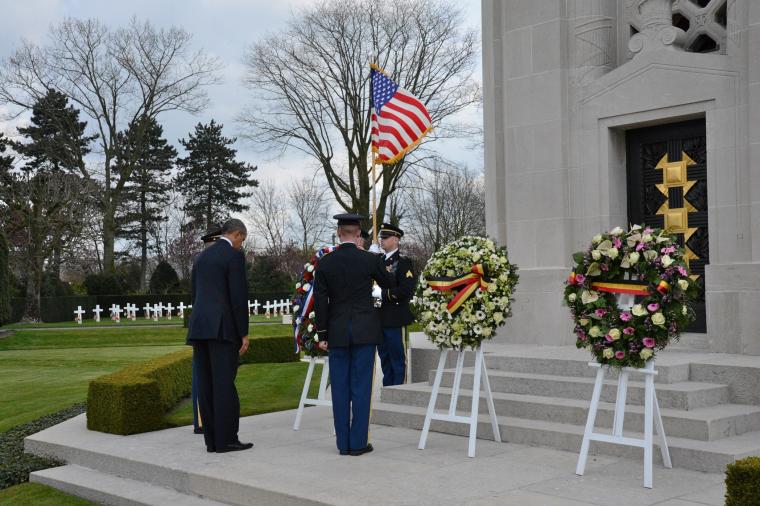 President Obama bows head after wreath-laying. 