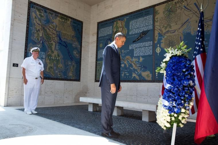 President Obama lays a wreath at Manila American Cemetery during his visit. 