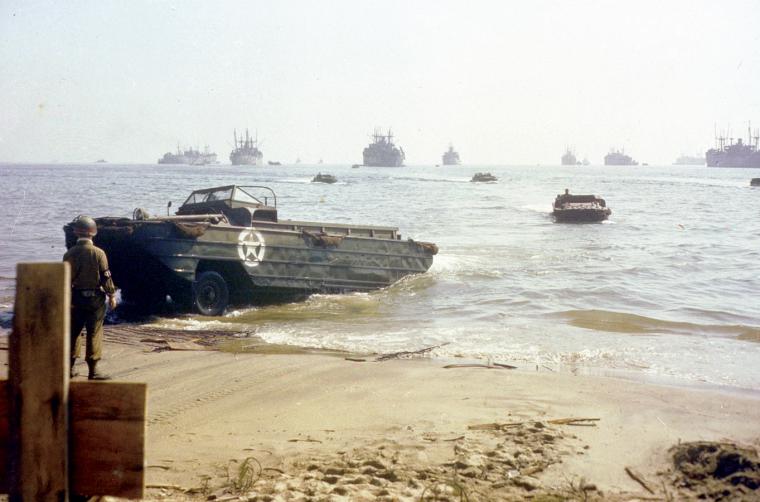 Amphibian trucks (DUKWs) bring supplies to a landing beach in Southern France in August 1944.