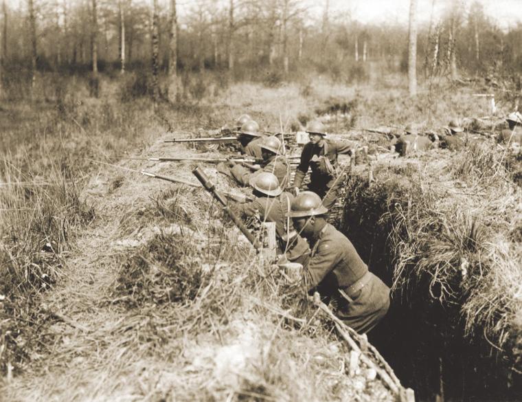Soldiers of the 369th Infantry Regiment, 93rd Division, in a trench.