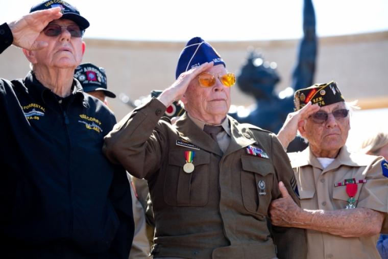 WWII veterans salute during Taps. 