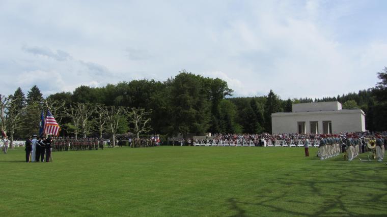 An overview of the cemetery shows the attendees and participants.