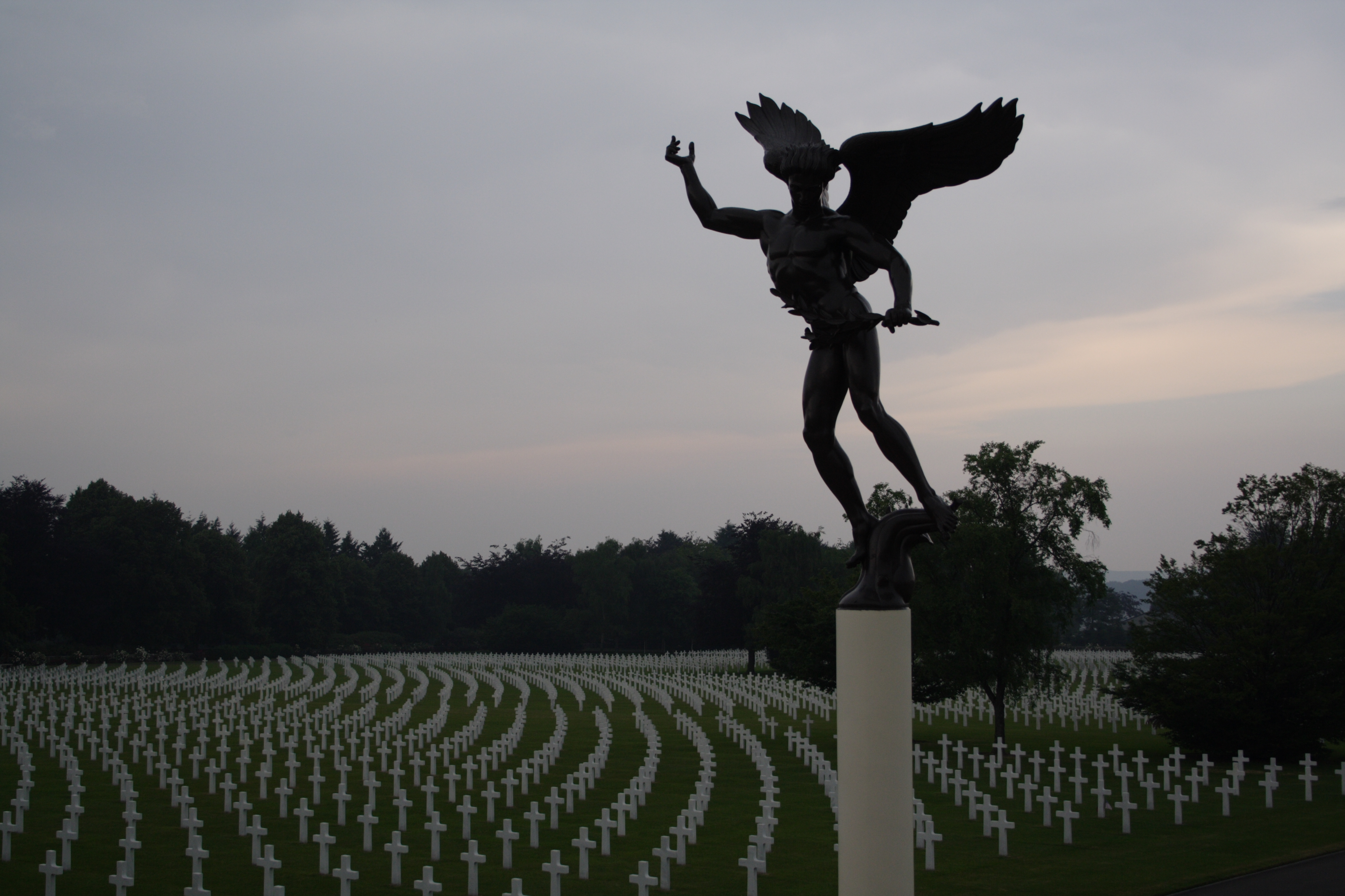 An angel statue looks over the rows of headstones at Henri-Chapelle American Cemetery.