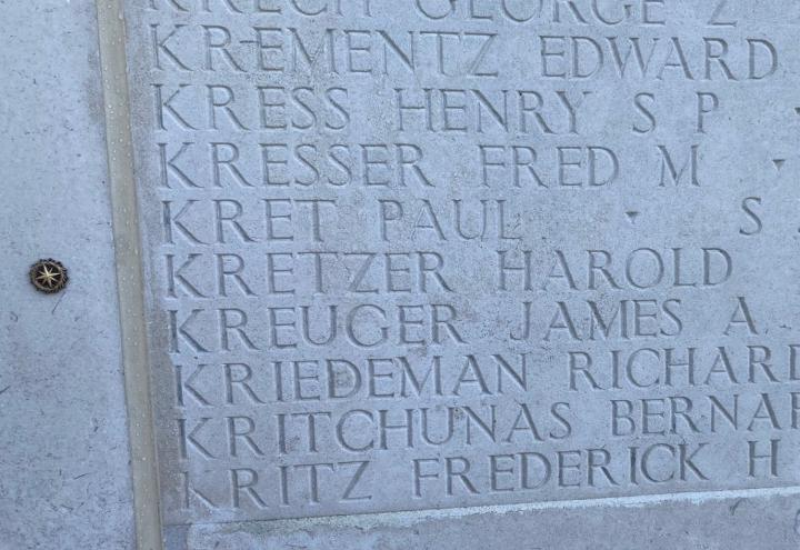A bronze rosette was placed next to Kretzer's name on Cambridge American Cemetery's Wall of the Missing.
