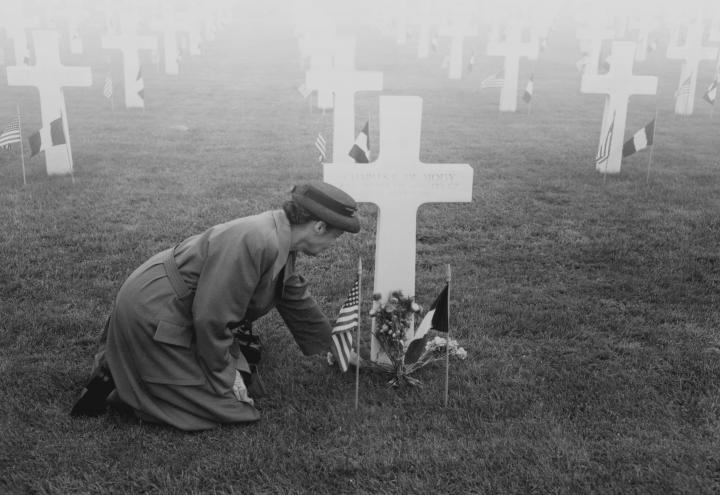 Gold Star Mother at her son's grave in France