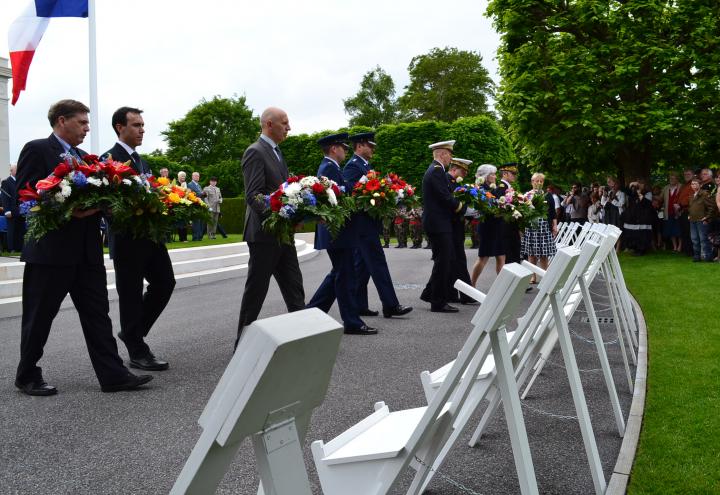 Members of the official party prepare to lay wreaths during the ceremony. 