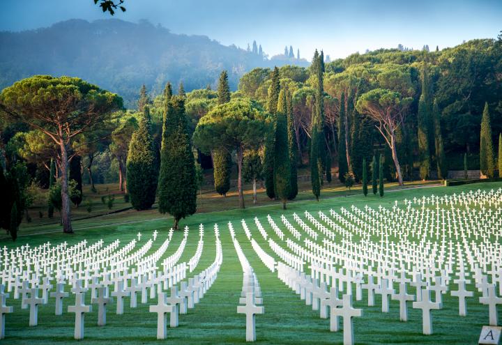 Rows of marble headstones dot the rolling landscape at Florence American Cemetery.