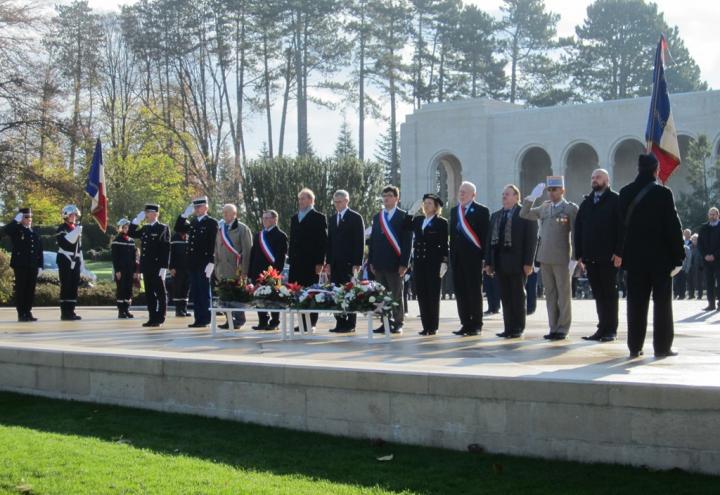 Members of the official party salute after the wreaths have been laid.