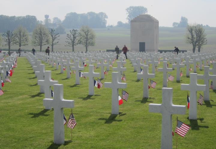 A French and an American flag are located in the ground in front of every headstone.