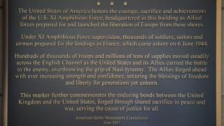 Text of this plaque commemorates the headquarters for the XI Amphibious Force.