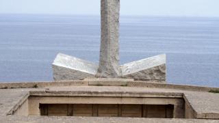 The Ranger Monument stands in front of the English Channel at Pointe du Hoc.