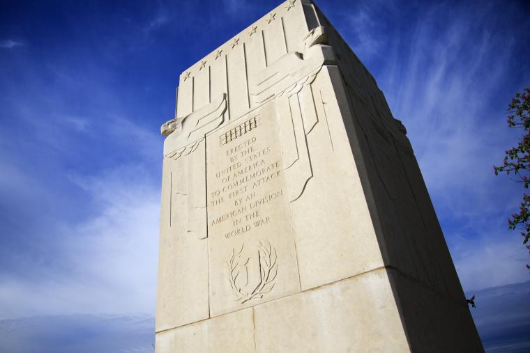 Inscription on the monument reads: "Erected by the United States of America to Commemorate the First Attack by an American Division in the World War."
