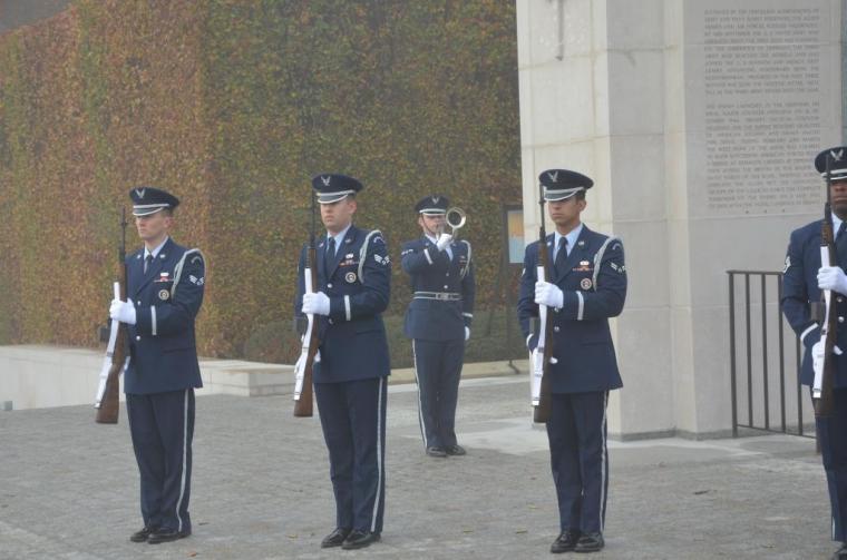 Members of the U.S. Air Force stand with guns, preparing for salute. 
