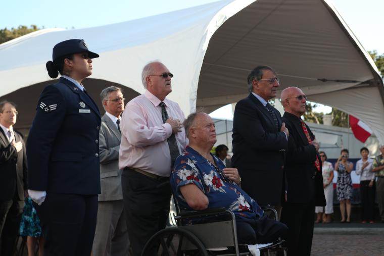 Secretary of Defense Leon Panetta flanked by ABMC staff prepares to lay a wreath.