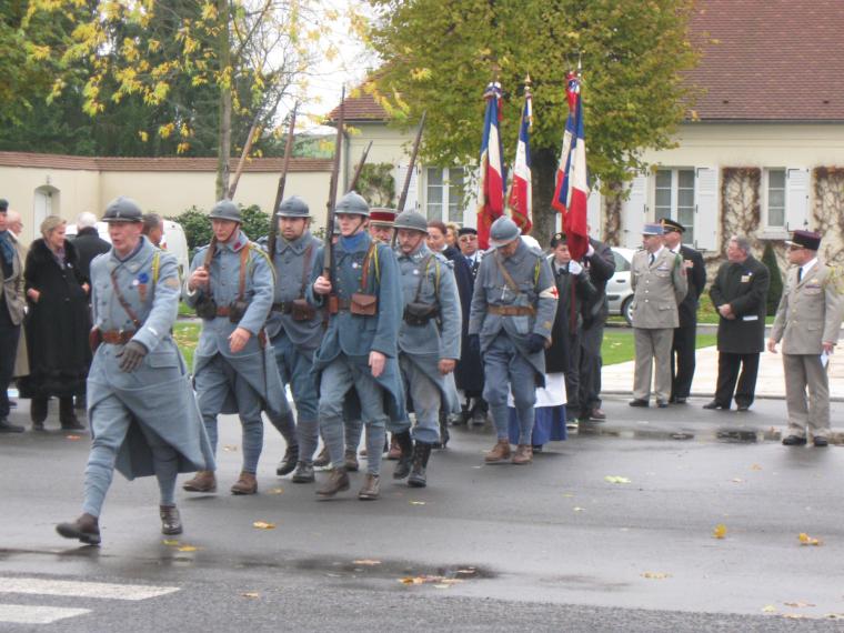 World War I re-enactors march in during the 2012 Veterans Day ceremony at Oise-Aisne American Cemetery. 