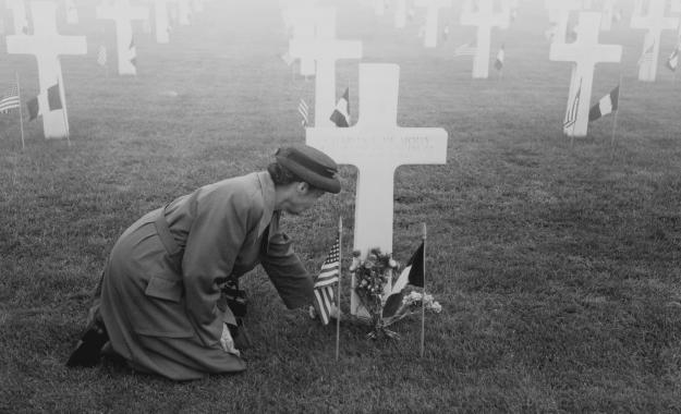 Gold Star Mother at her son's grave in France