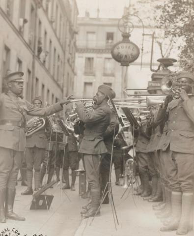 @NARA. 1st Lt. James Reese Europe of the 369th Regt. Inf. playing for the patients of American Red Cross Hospital #9, Paris, France. September 1918. @NARA. 1st Lt. James Reese Europe of the 369th Regt. Inf. playing for the patients of American Red Cross Hospital #9, Paris, France. September 1918.