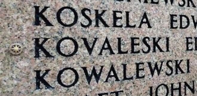 Rosette pictured next to Air Force Sgt. Edward S. Kovaleski's name on the Wall of the Missing in Florence American Cemetery.