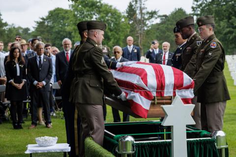 American soldiers carry the casket of 1st Lt. Baskind at Normandy American Cemetery