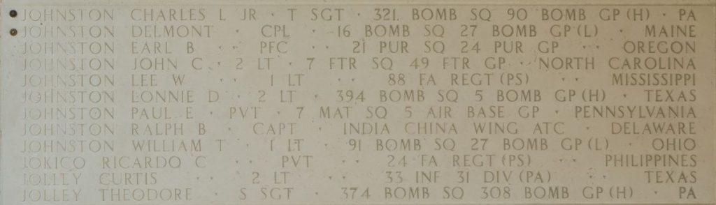 A rosette next to the name of Cpl. Delmont Johnston on the Walls of the Missing at Manila American Cemetery signifies he has been identified. (ABMC photo)