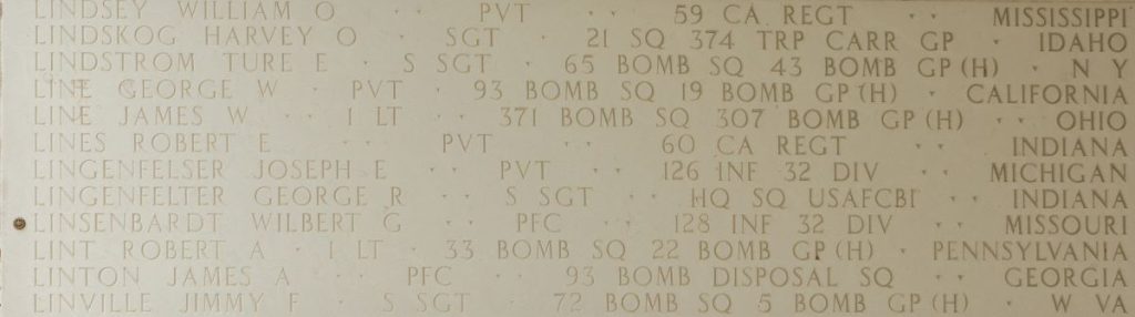 A bronze rosette next to the name of Pfc. Wilbert G. Linsenbardt on the Walls of the Missing at Manila American Cemetery signifies he has been identified. (ABMC photo)