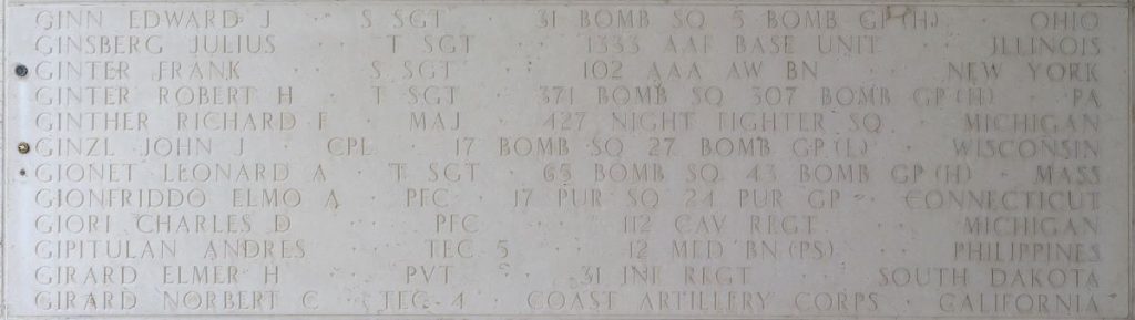 A rosette next to the name of Cpl. John J. Ginzl on the Walls of the Missing at Manila American Cemetery signifies he has been identified. (ABMC photo)